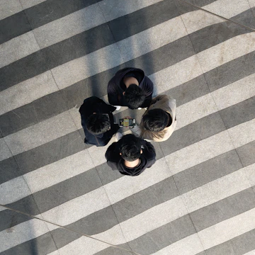 A group of friends checking their ranks together on a tablet.