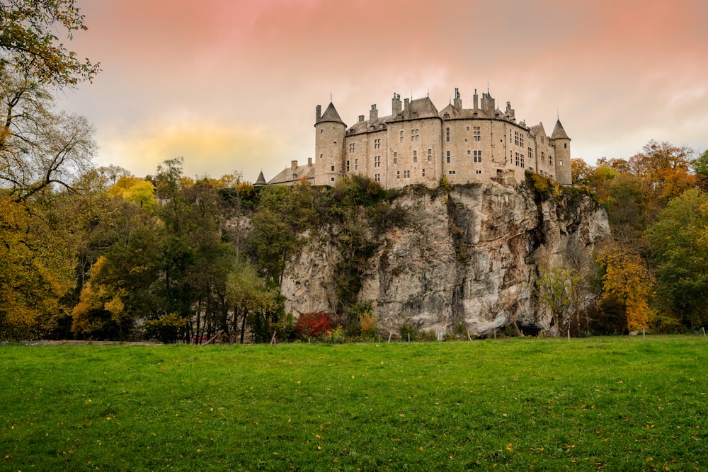 gray concrete castle on green grass field during daytime