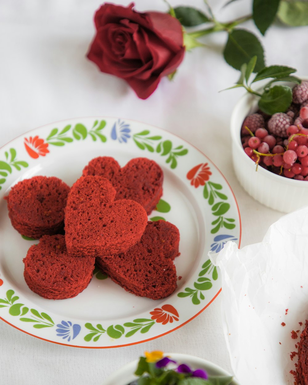 red raspberries on white ceramic bowl