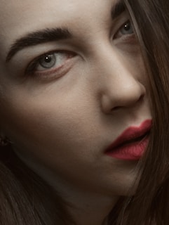 Close-up of Luda's faintly judgmental gaze, eyes half-lidded with a hint of disdain.