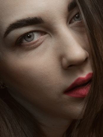 Close-up of Luda's faintly judgmental gaze, eyes half-lidded with a hint of disdain.