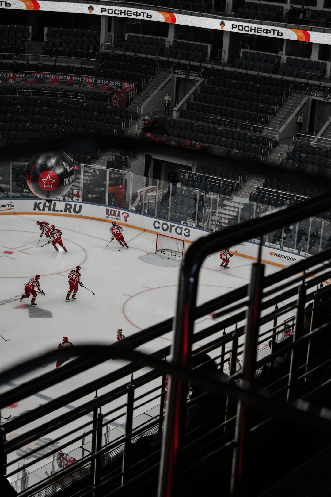 people playing ice hockey on ice stadium