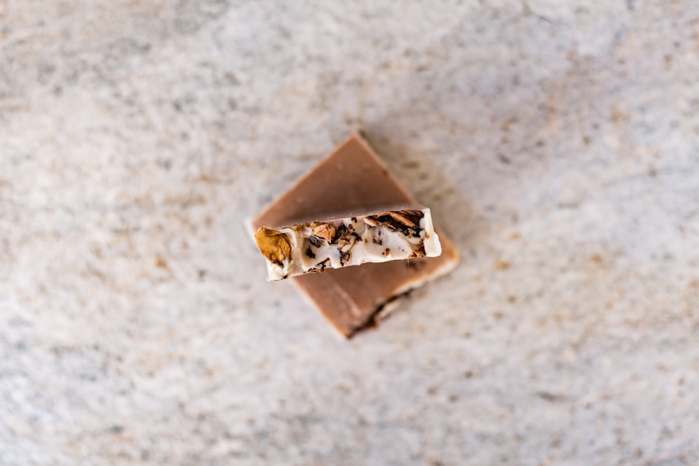 brown and white chocolate bar on white and brown marble table