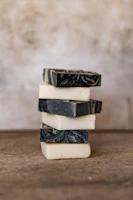 Artisan soap bars stacked with natural textures and earthy tones in soft natural light