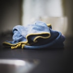 blue denim textile on black table