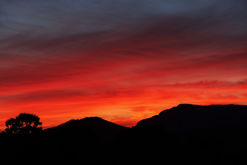 silhouette of mountain during sunset