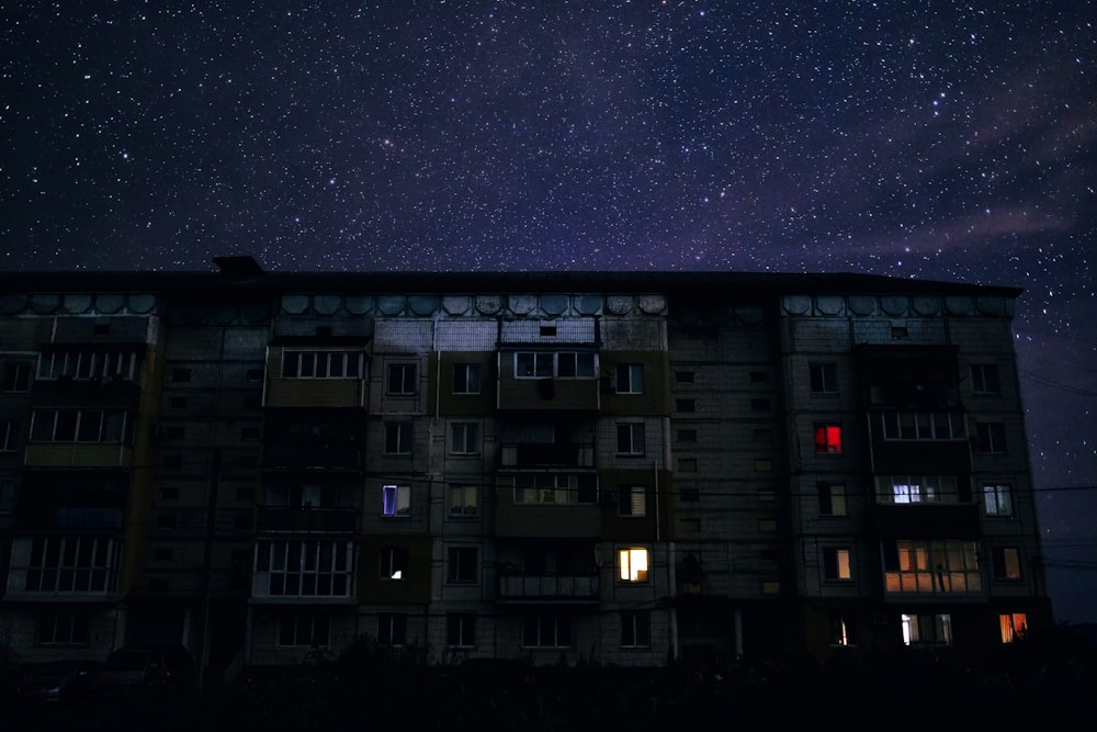 white and black concrete building under starry night