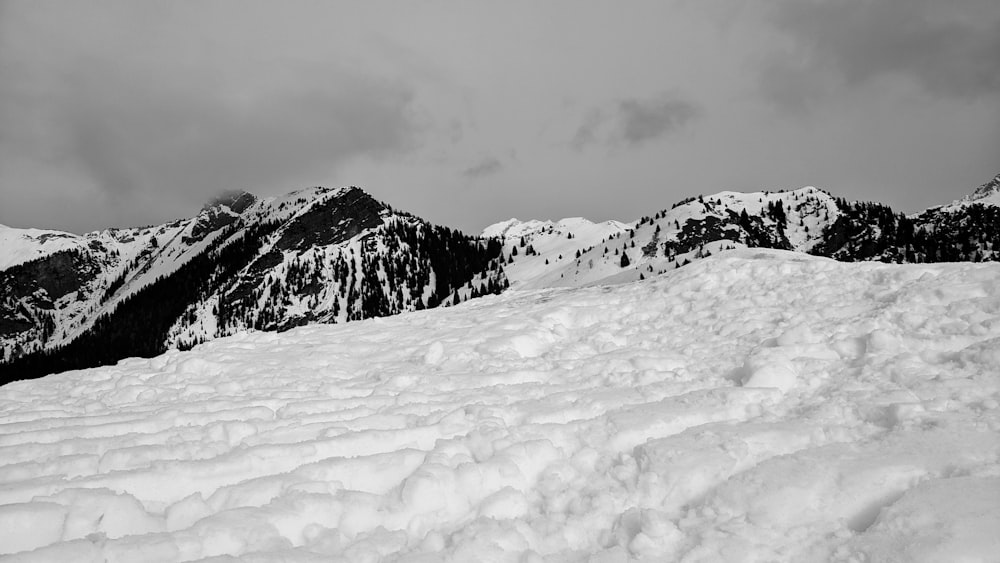 snow covered mountain under cloudy sky during daytime