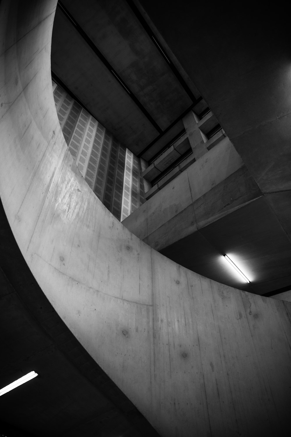 grayscale photo of spiral staircase