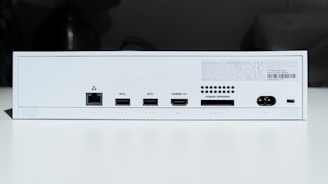 white electronic device turned on in a room