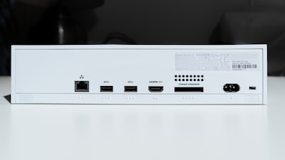 white electronic device turned on in a room