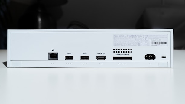 white electronic device turned on in a room