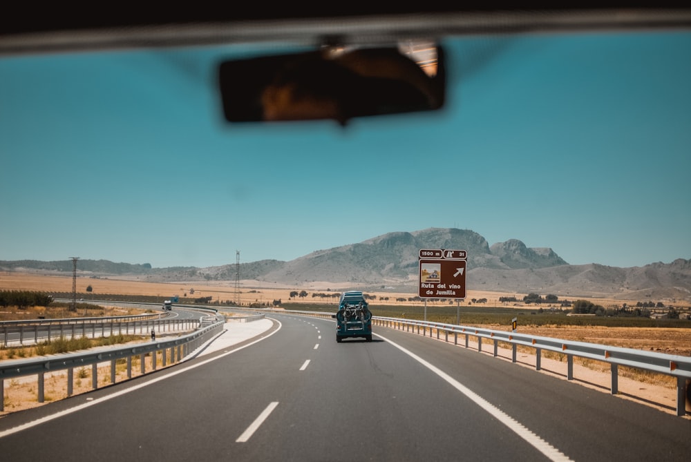 black car on road during daytime