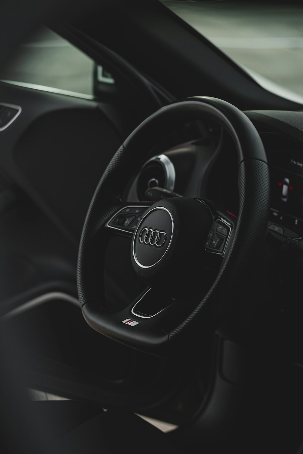 a steering wheel and dashboard of a car