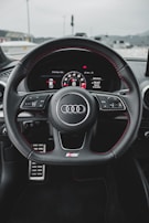 black and gray audi steering wheel