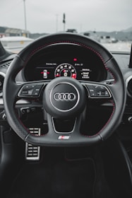 black and gray audi steering wheel