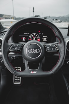 black and gray audi steering wheel