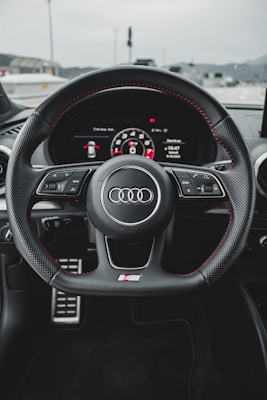 black and gray audi steering wheel