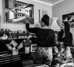 Illustration of two people chatting happily, one with Persian motifs and the other with German minimalism.