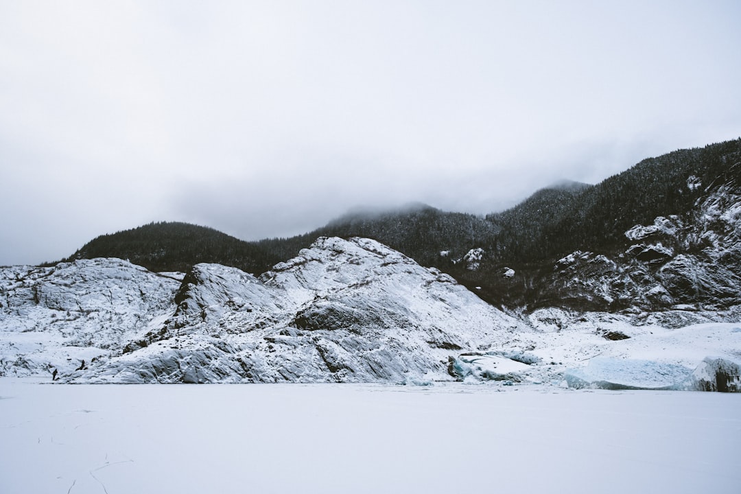 snow covered mountain during daytime