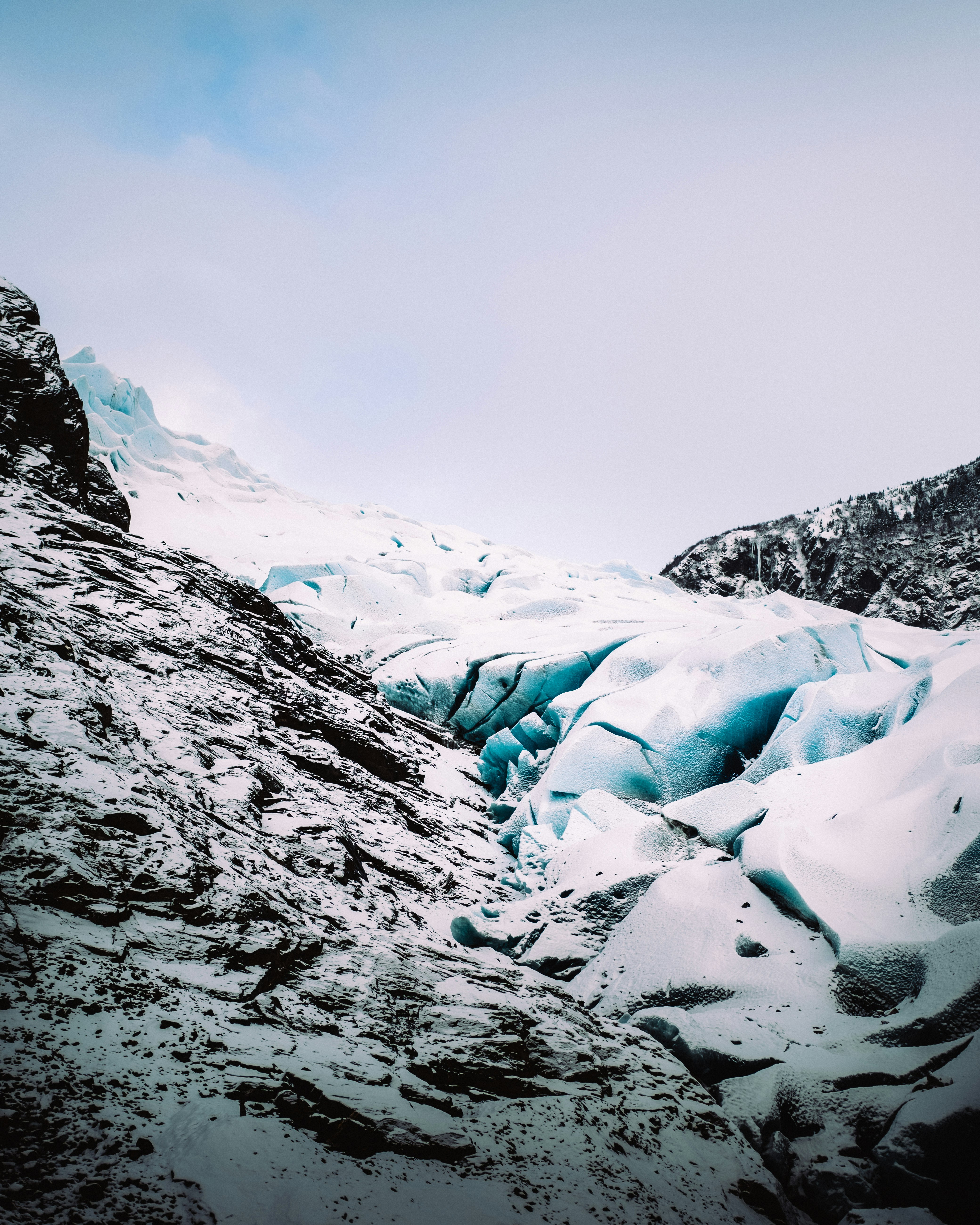 snow covered mountain during daytime