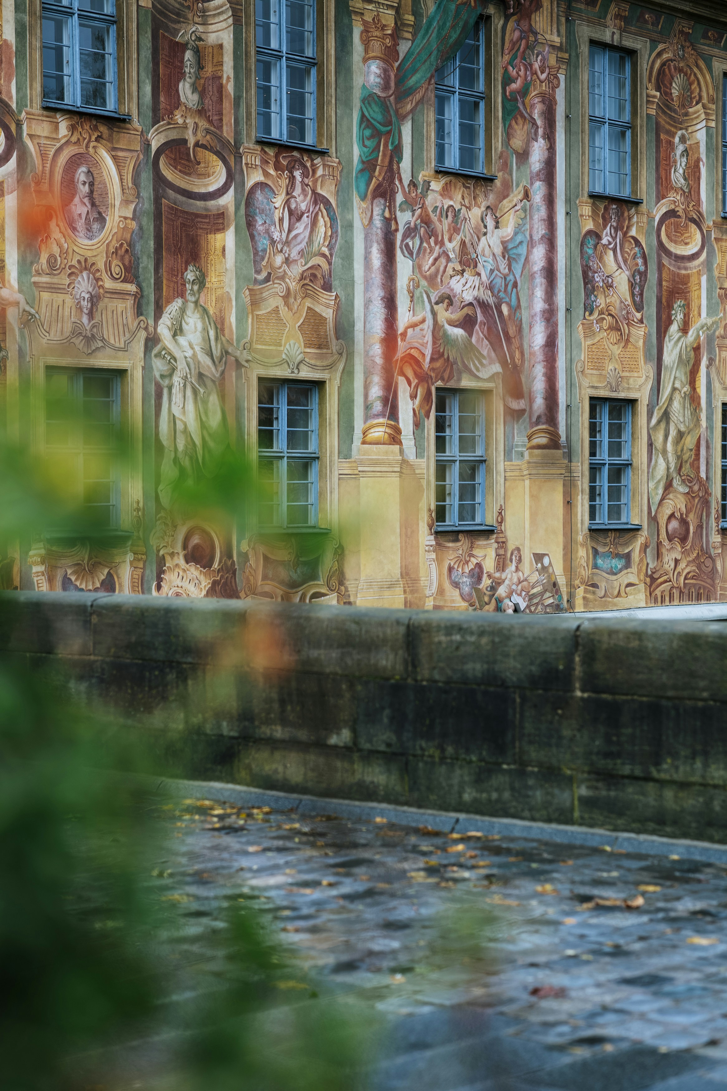 people in park near brown concrete building during daytime
