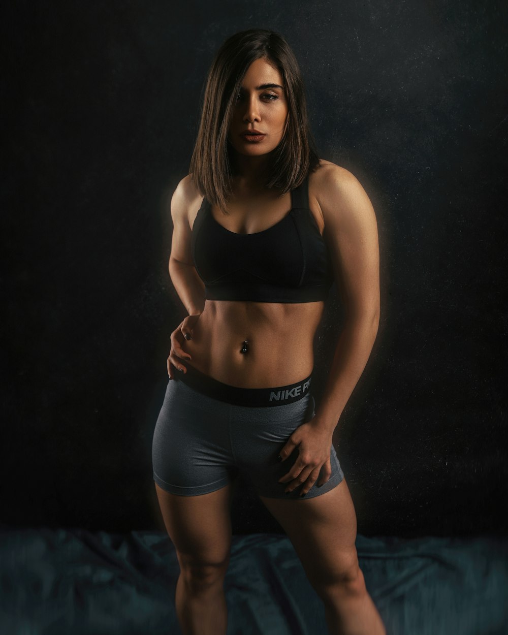 woman in black sports bra and black shorts