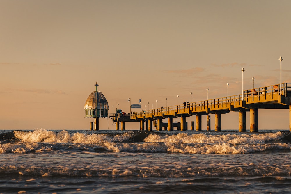 people walking on beach dock during daytime