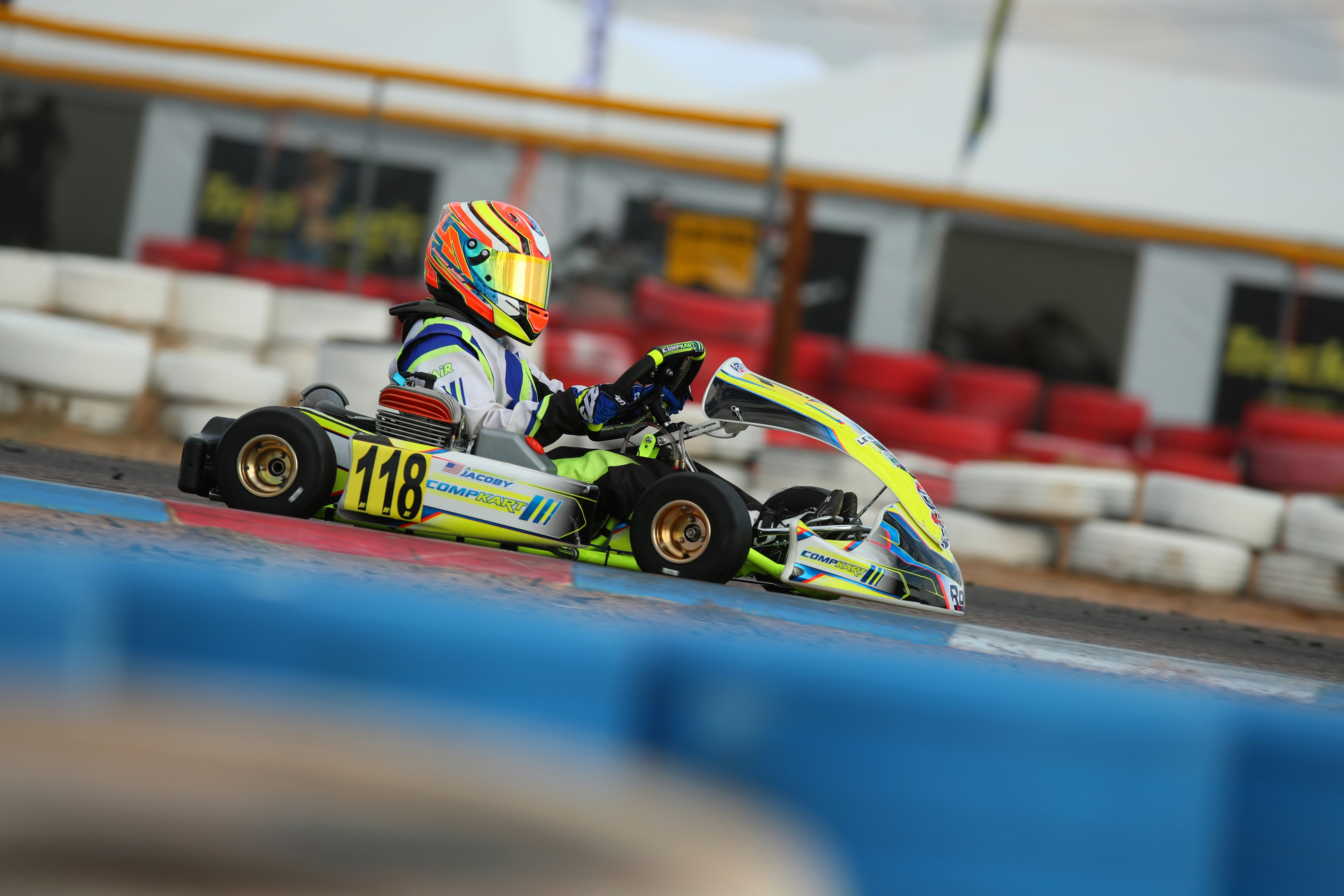 man riding on go kart