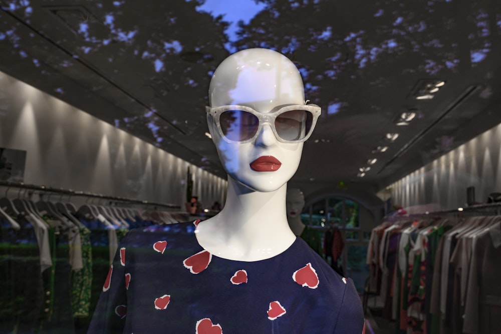 person wearing blue and red floral crew neck shirt and white goggles