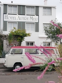 A modern shuttle van parked near the thermal pools of Pamukkale ready for guests.