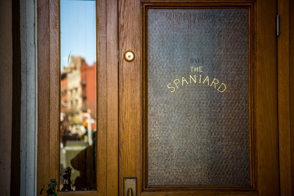 brown wooden framed glass door