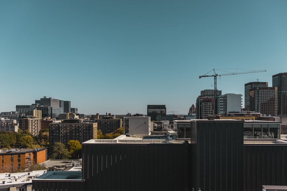 a view of a city with a crane in the background