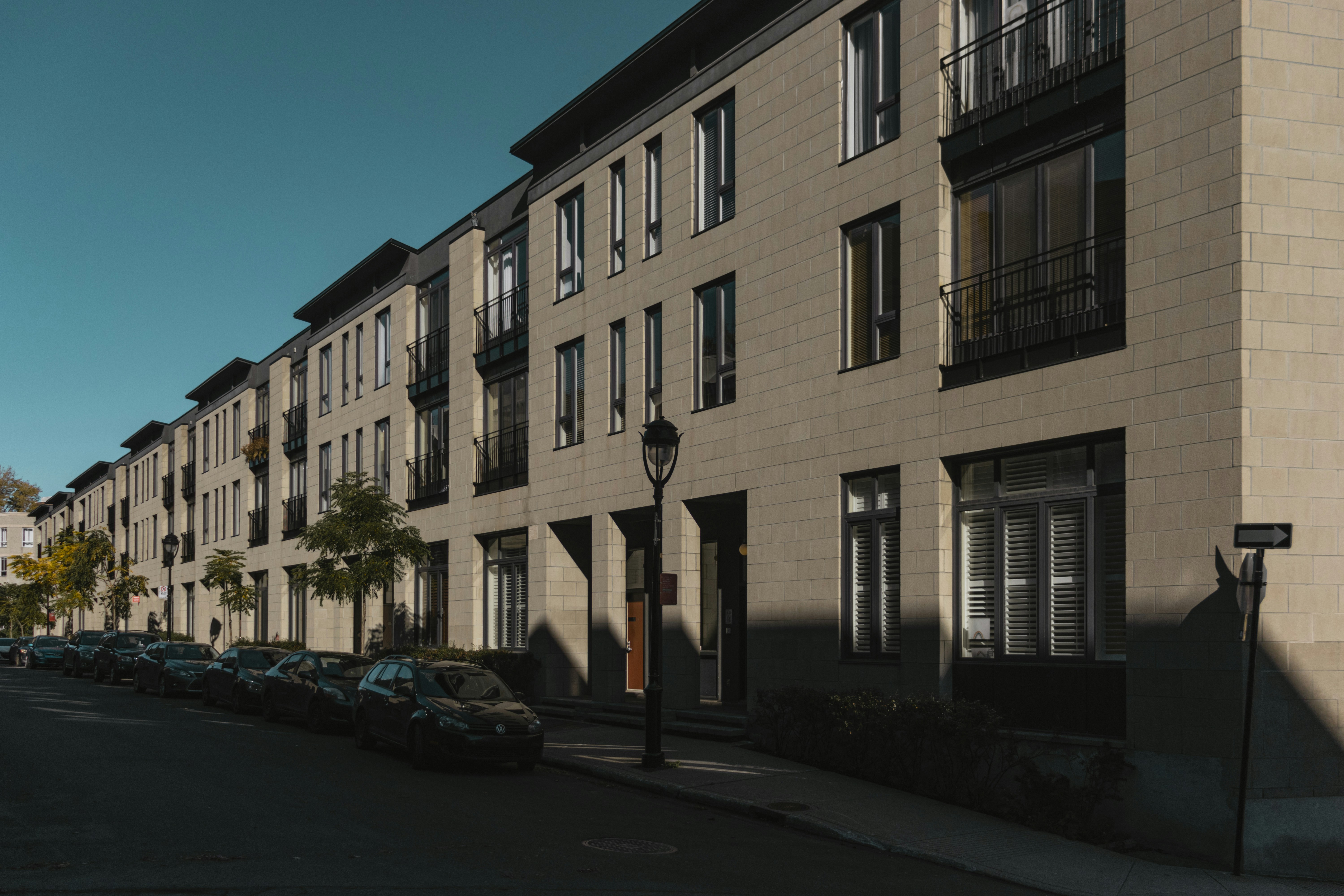 cars parked in front of building during daytime