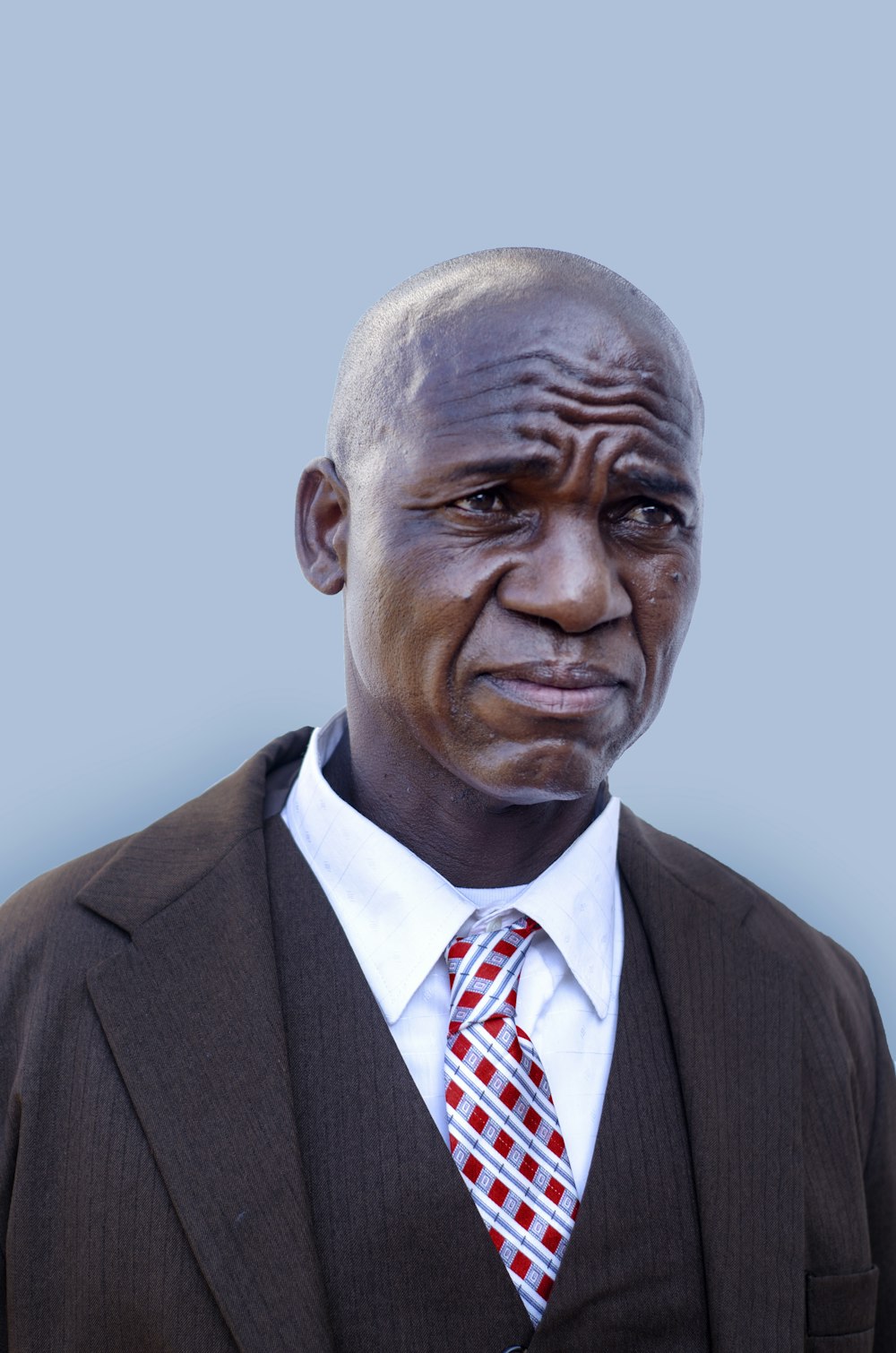 a man in a suit and tie with a serious look on his face