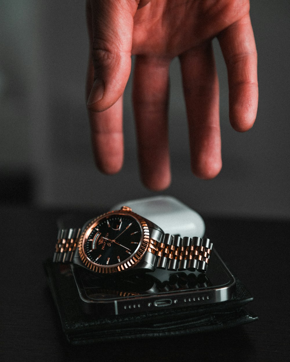 black and silver round analog watch