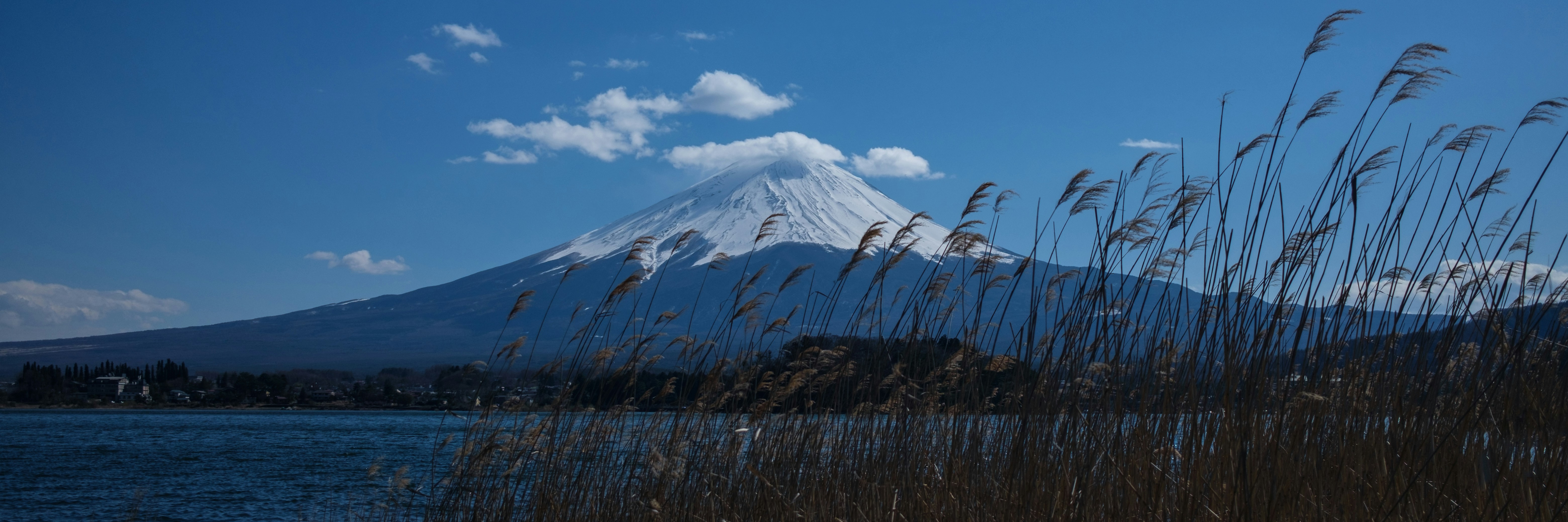snow covered mountain under blue sky during daytime