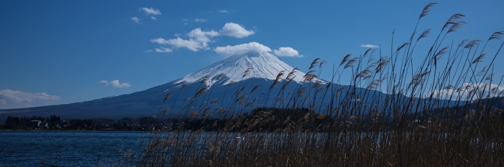 snow covered mountain under blue sky during daytime