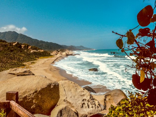 Brown rock formation near body of water during daytime — Santa Marta, Colombia