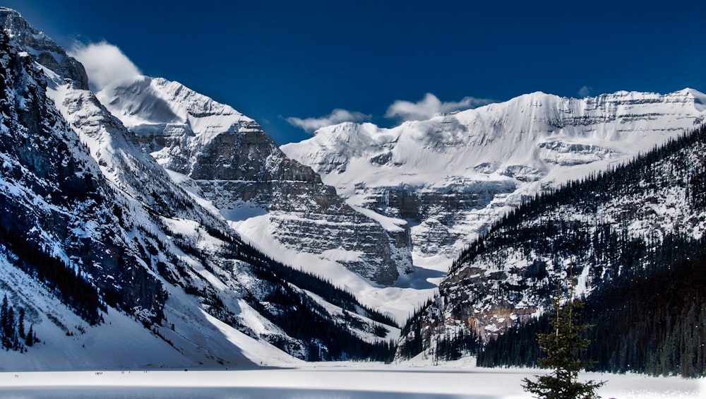 snow covered mountain under blue sky during daytime