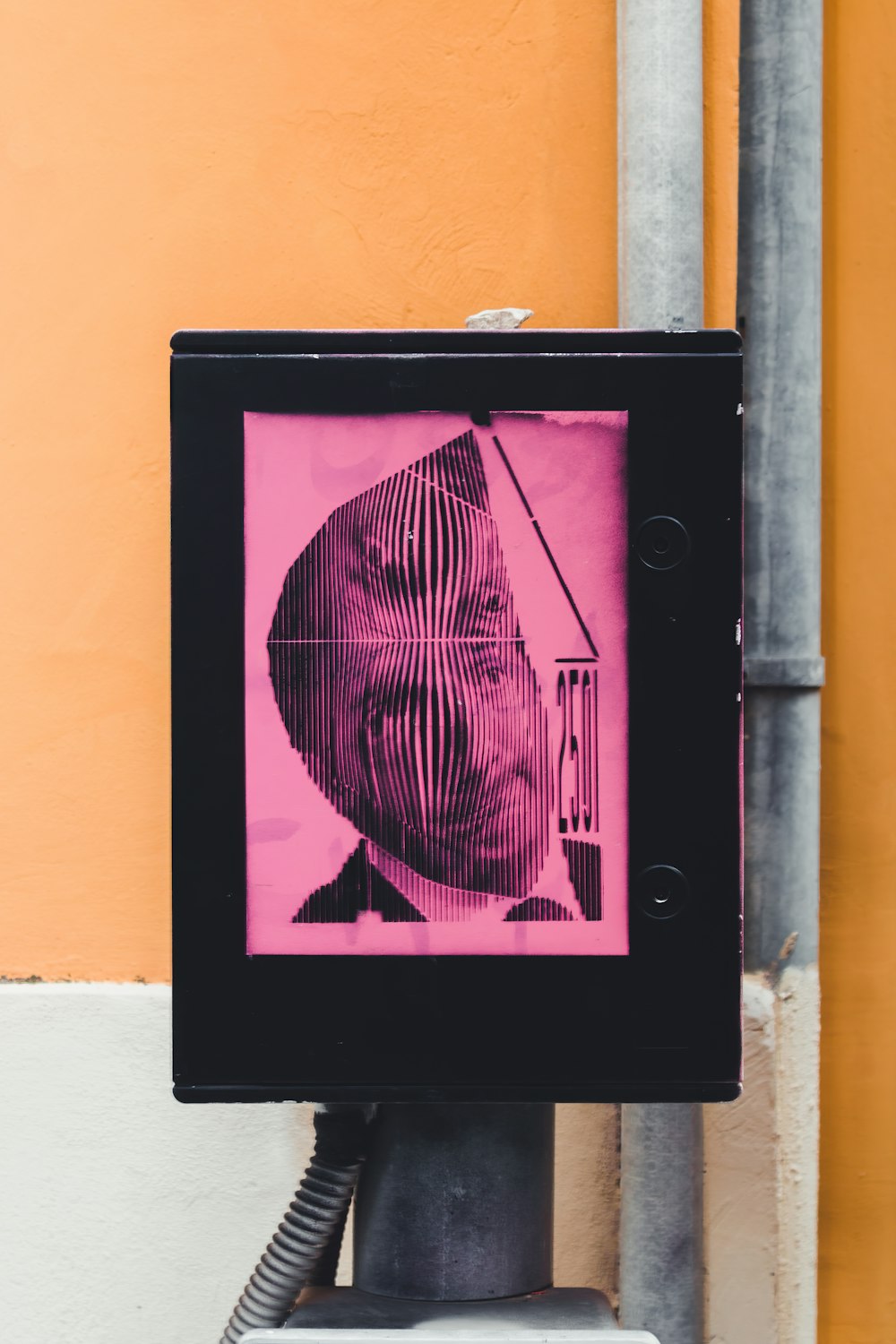 black wooden frame on orange wall