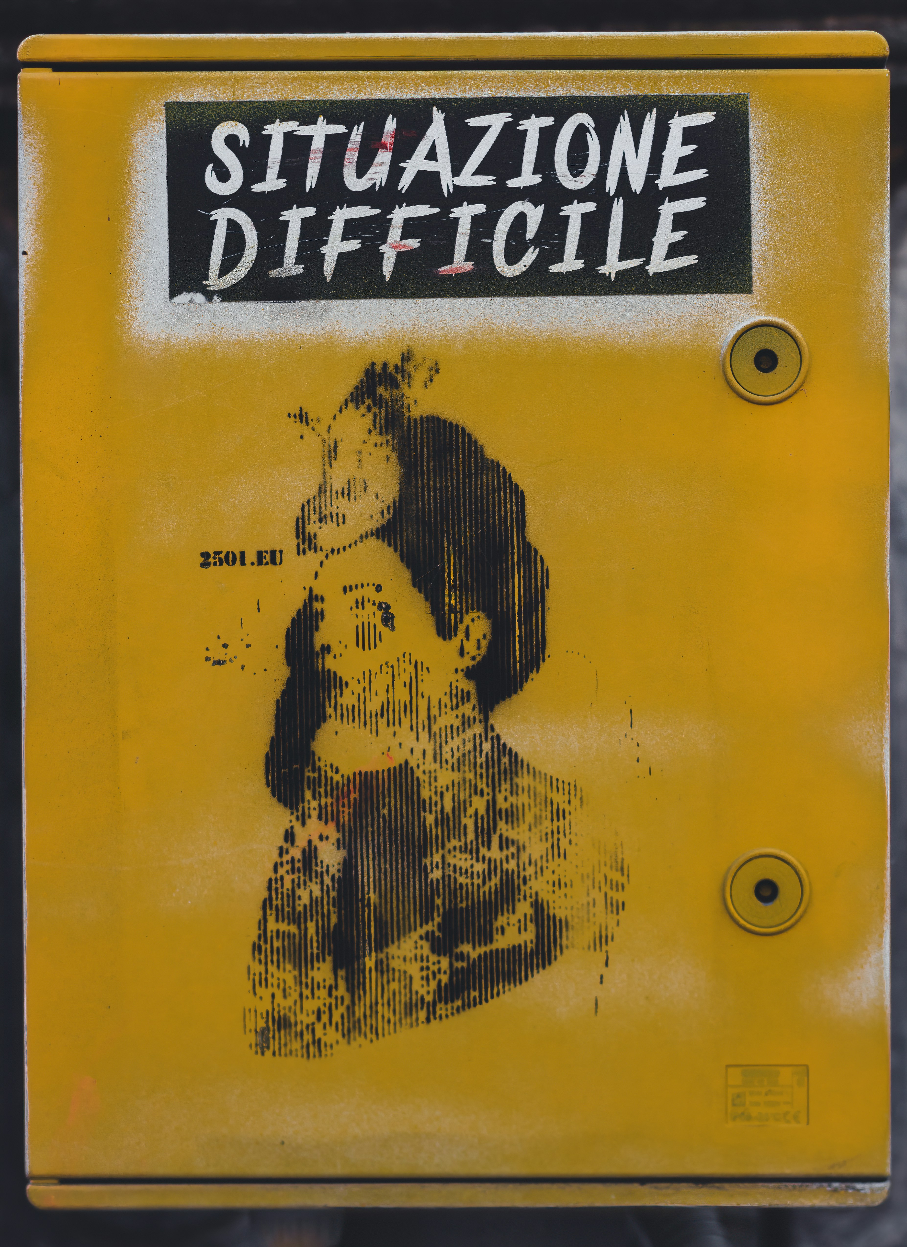 a yellow sign with a picture of a woman on it