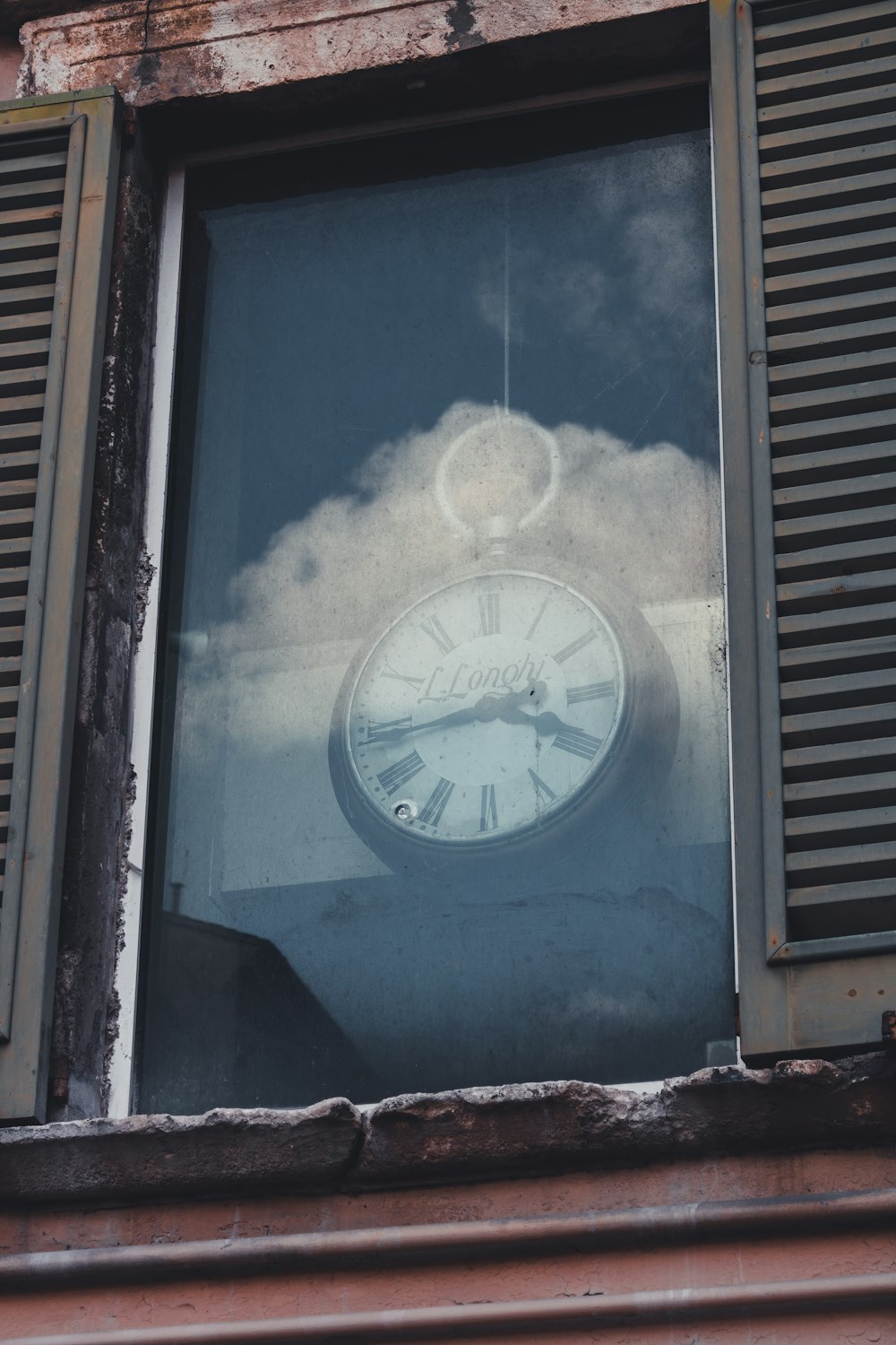 blue and white analog wall clock