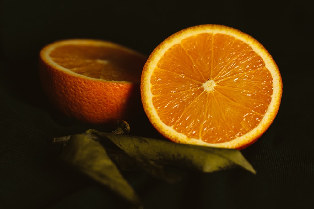 orange fruit on black surface