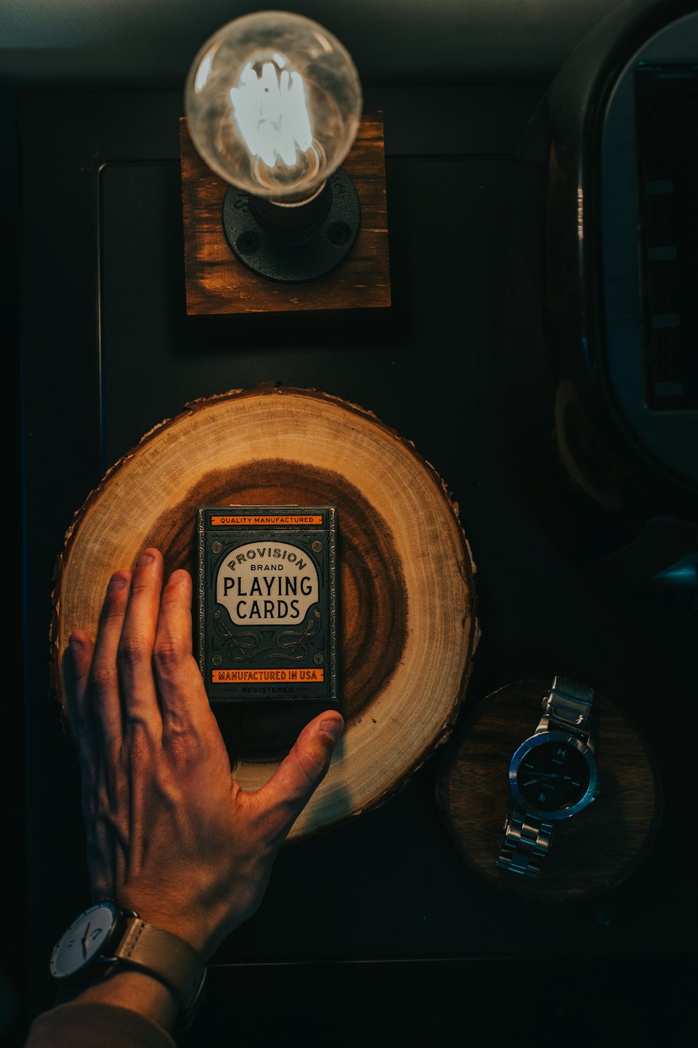 person holding round brown wooden round table