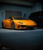 orange lamborghini aventador parked in garage