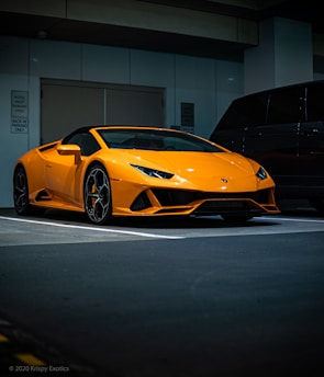 orange lamborghini aventador parked in garage