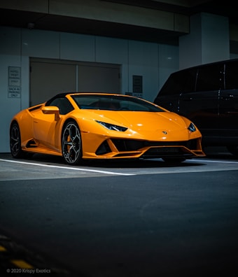 orange lamborghini aventador parked in garage