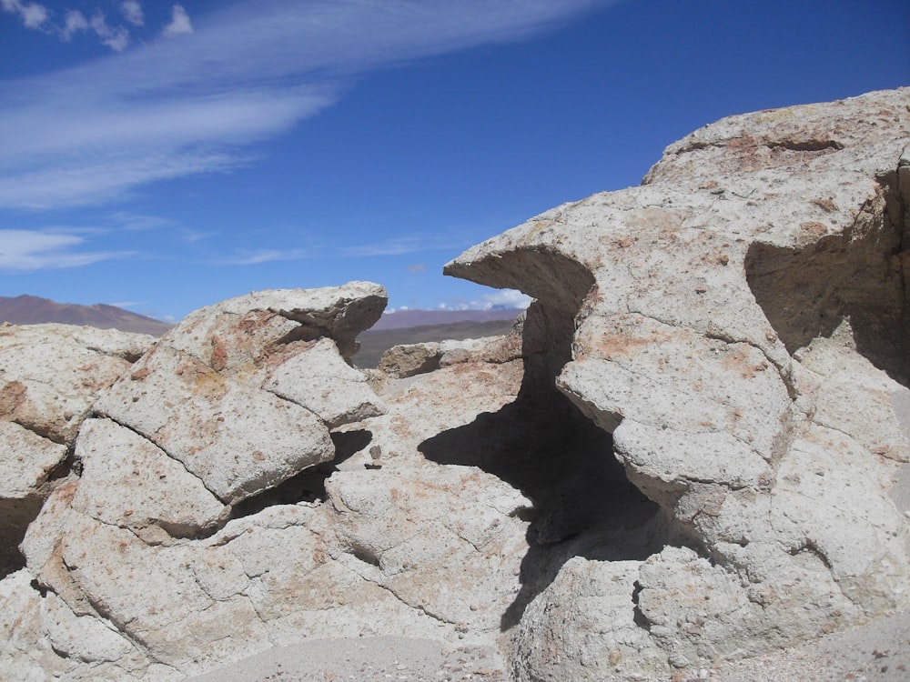 gray rock formation under blue sky during daytime