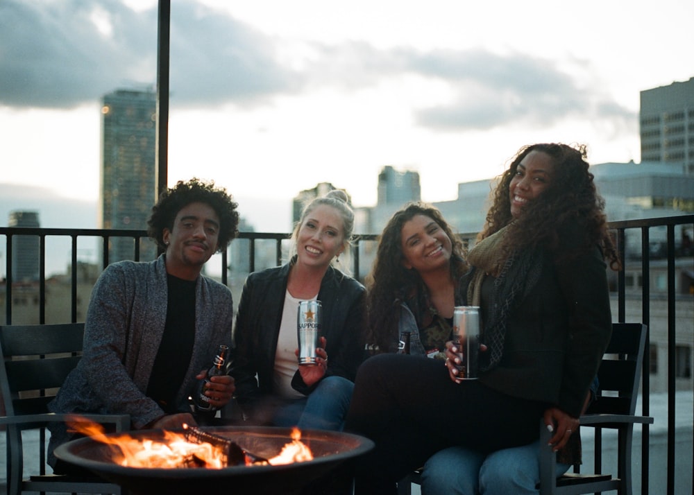 group of people sitting on bench